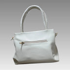 Bolso efecto rombo con charm de flor