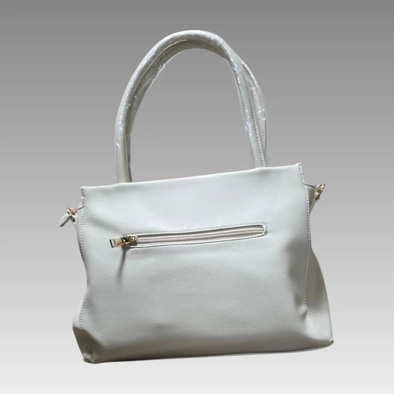 Bolso efecto rombo con charm de flor
