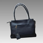 Bolso efecto rombo con charm de flor