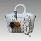 Bolso calado con pompón