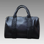 Maxi bolso tipo baúl trenzado negro